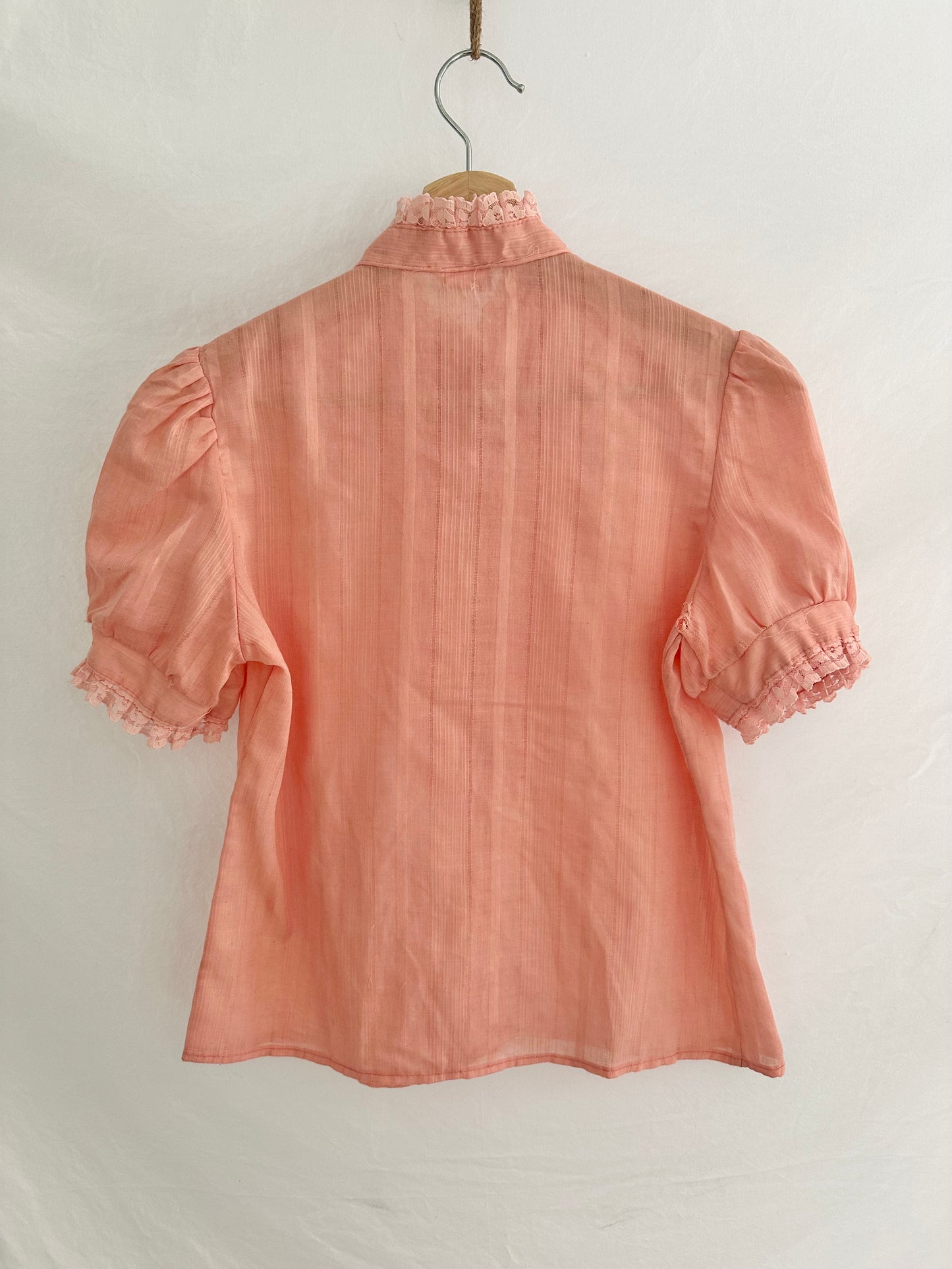 pink ruffle blouse